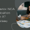 A professional woman in glasses sits at a desk with documents and a laptop, engaged in an online discussion, with text overlay reading, "Is Nutanix NCA Certification Worth It? Benefits & Salary."